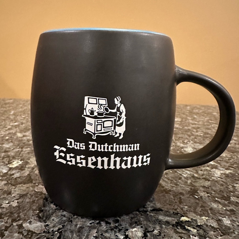 Das Dutchman Essenhaus Ceramic Black Mug Sky Blue Rim and inside 14 oz NEW